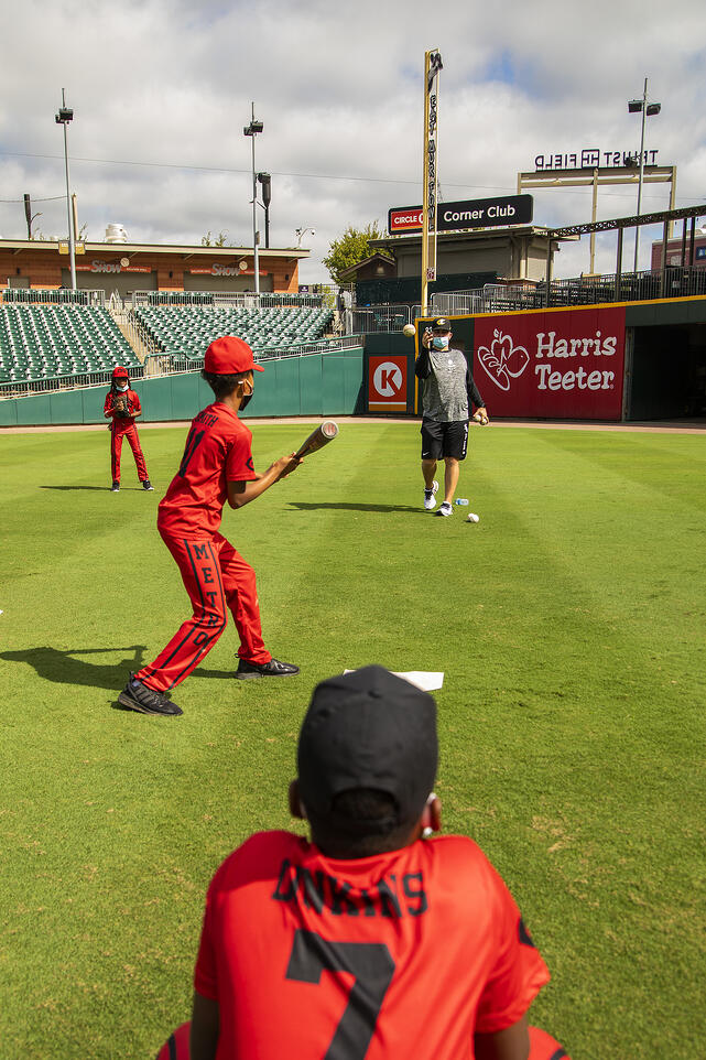 kids learning skills from the Charlotte Knights players