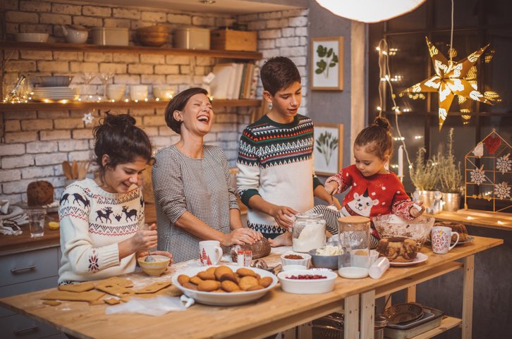 Family having fun safely while baking cookies