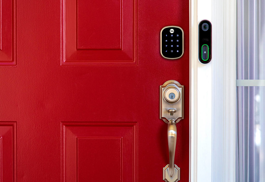 front door with CPI doorbell and smart lock