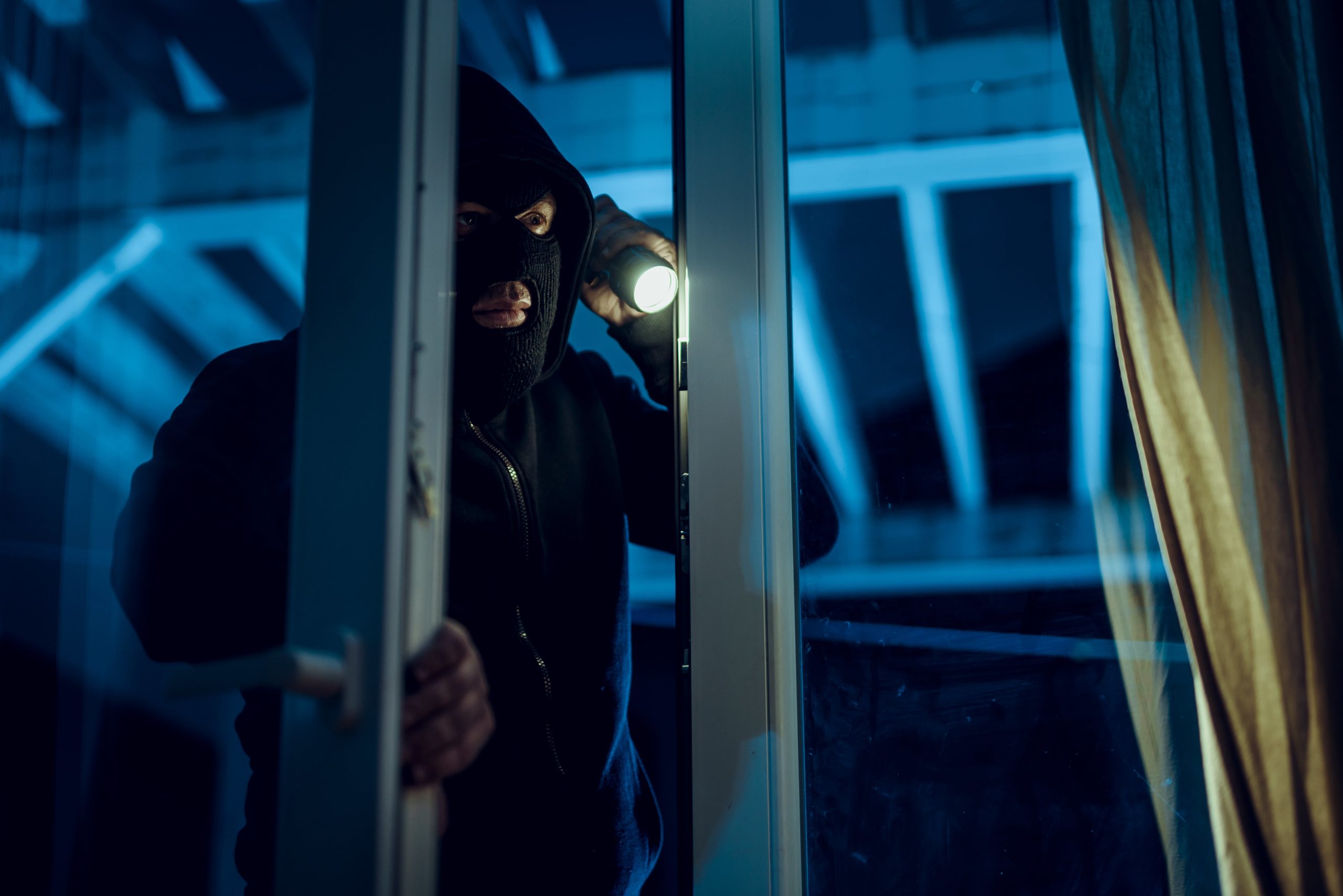 Burglar Peering into Home