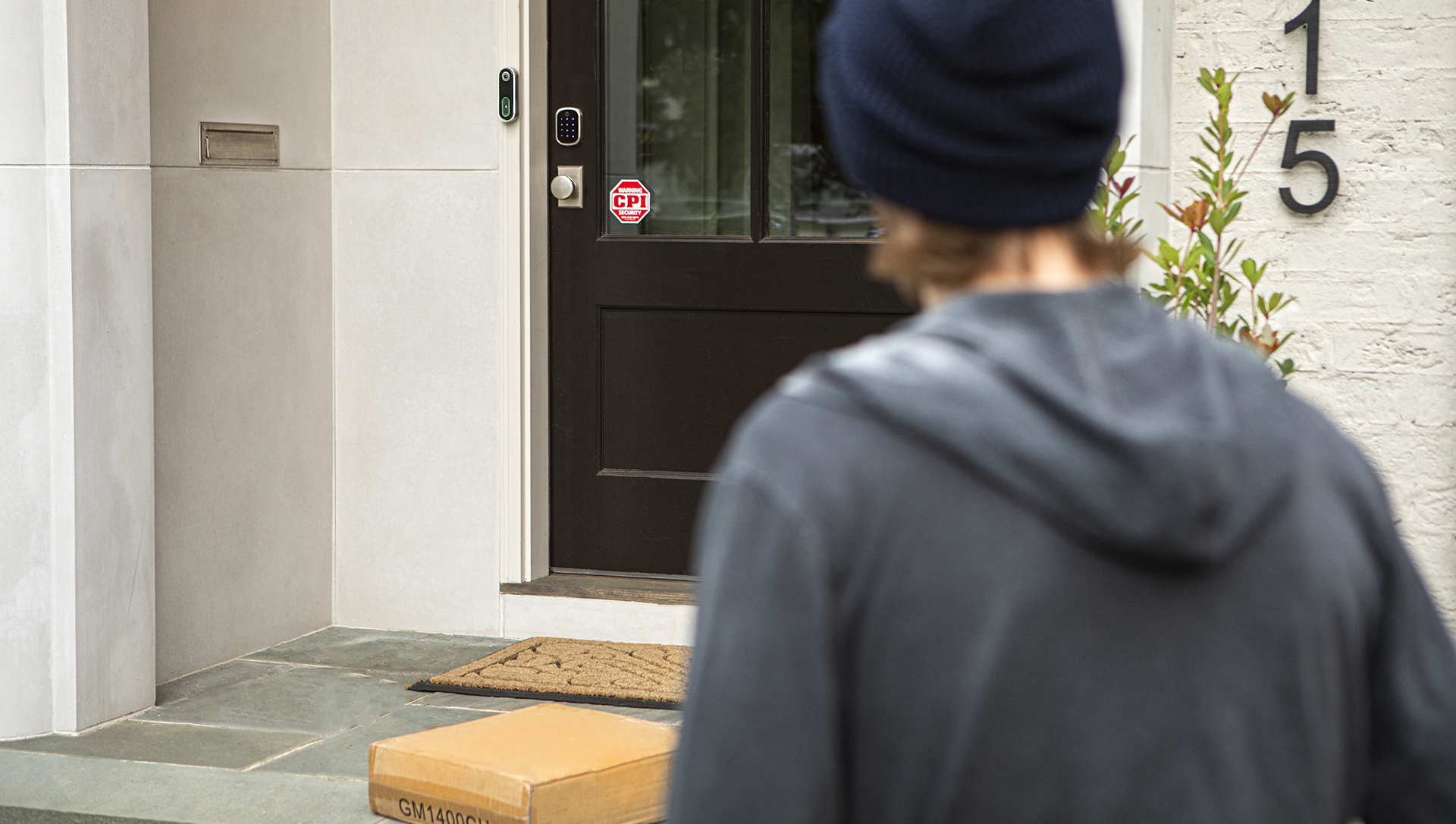 Burglar Observing Package on Doorstep