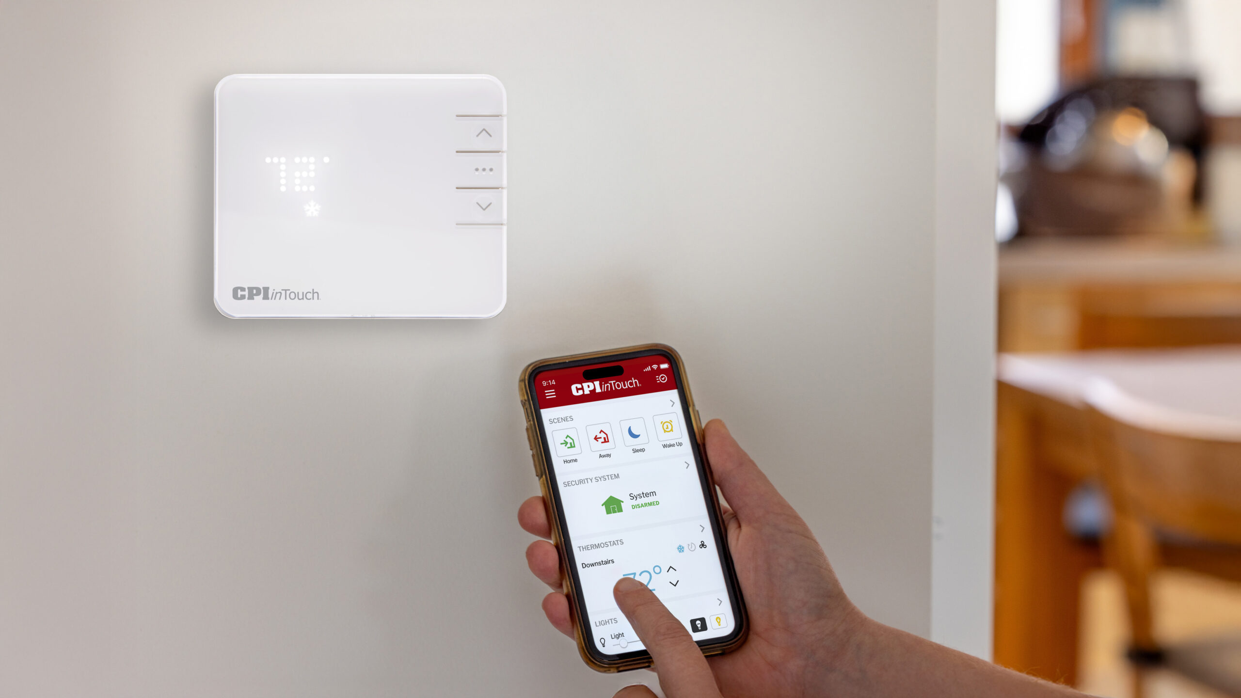 smart thermostat next to a smart phone with the CPI Security InTouch app showing the benefits of levelized billing