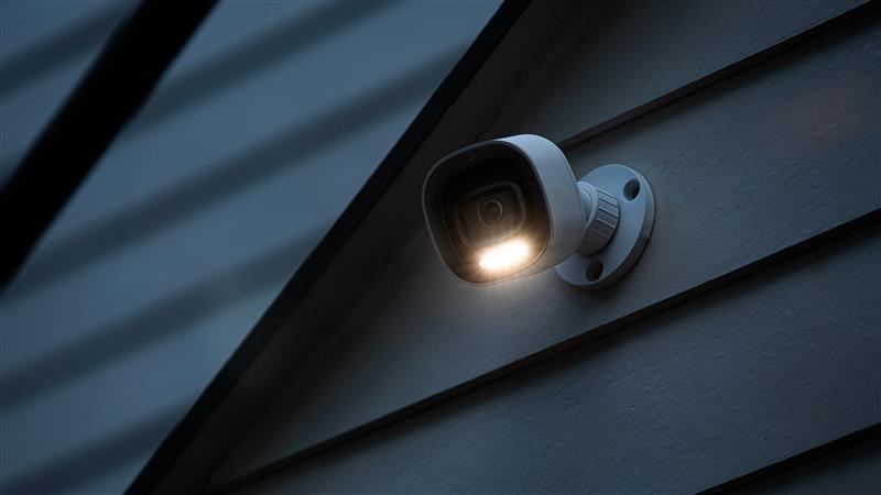 outdoor spotlight camera on side of house
